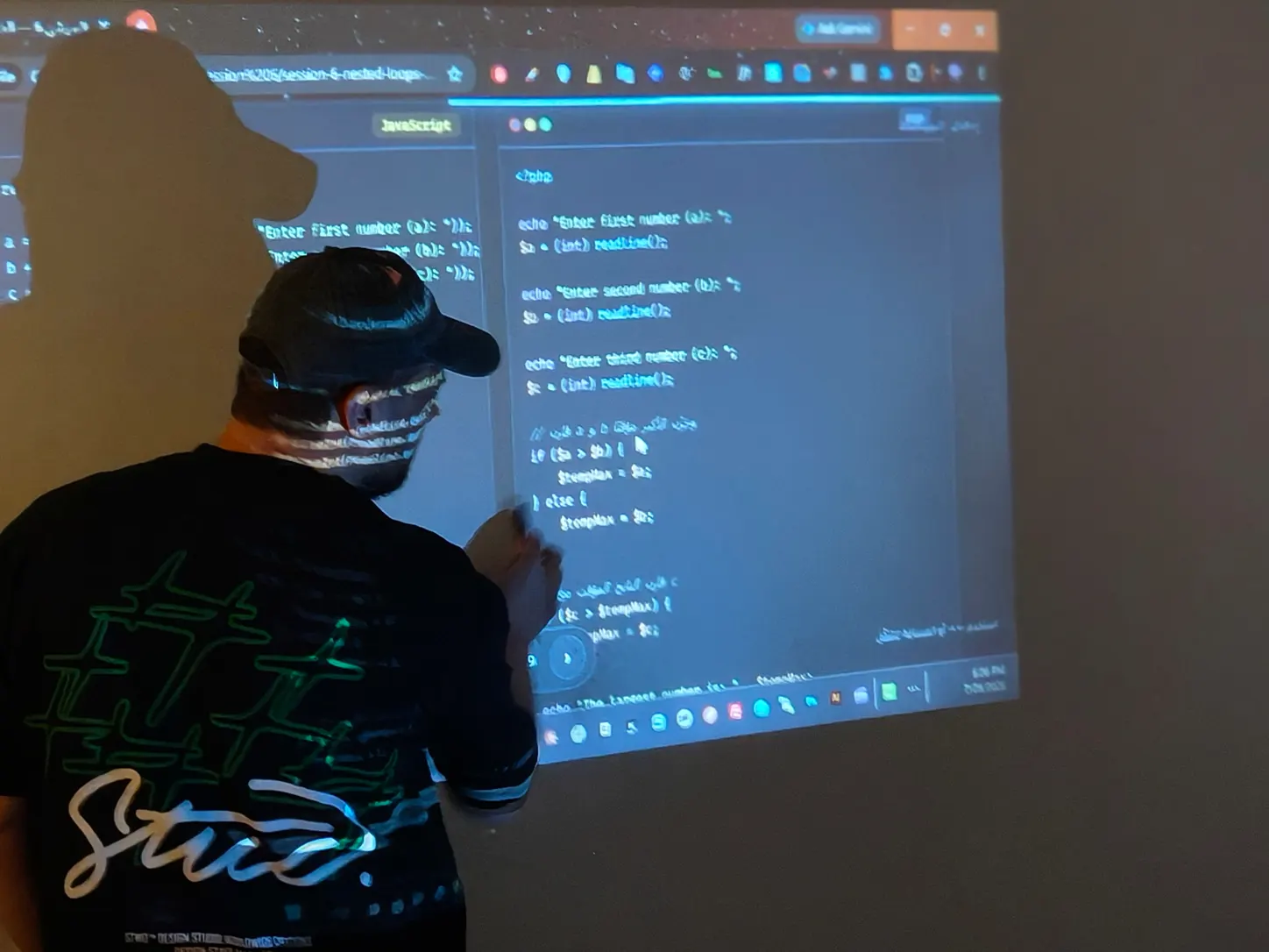 Ayman Gaber teaching programming fundamentals to a group of students